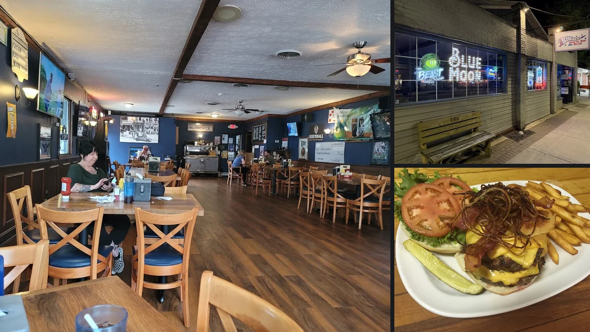 Wood-paneled sports bar with mounted screens.
